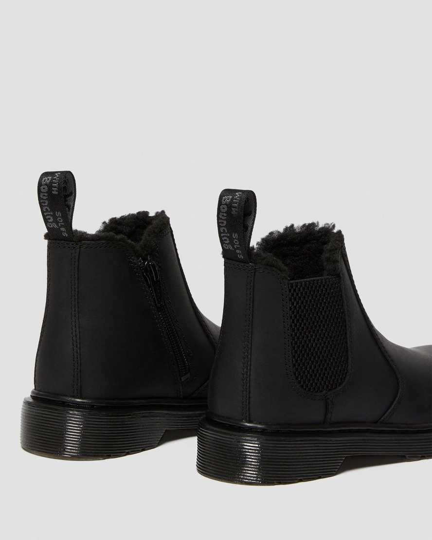 svarta dr martens 2976 chelsea-stövlar med fuskpälsfoder för barn